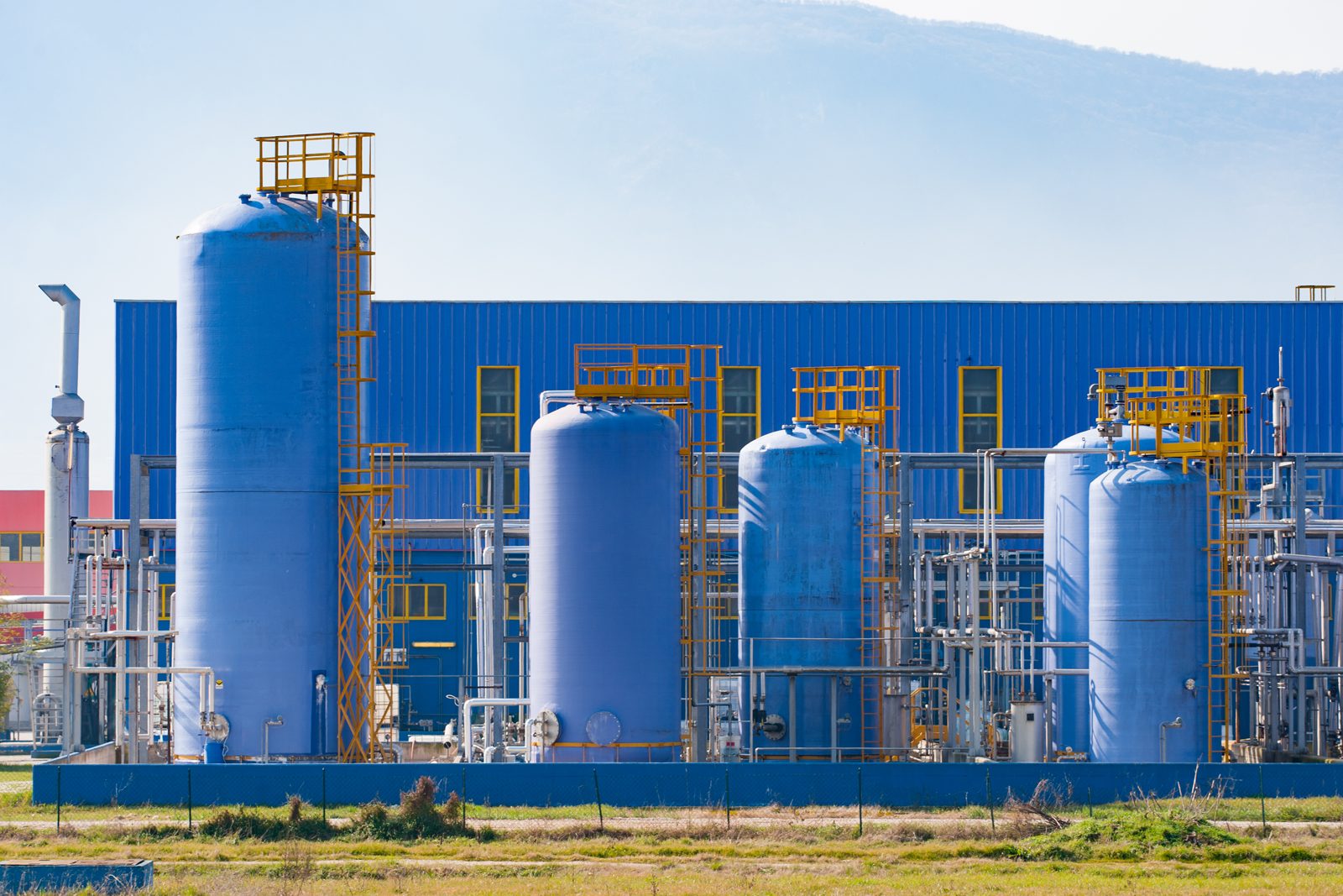Chemical manufacturing plant with blue storage tanks, representing suppliers listed on CASINDI