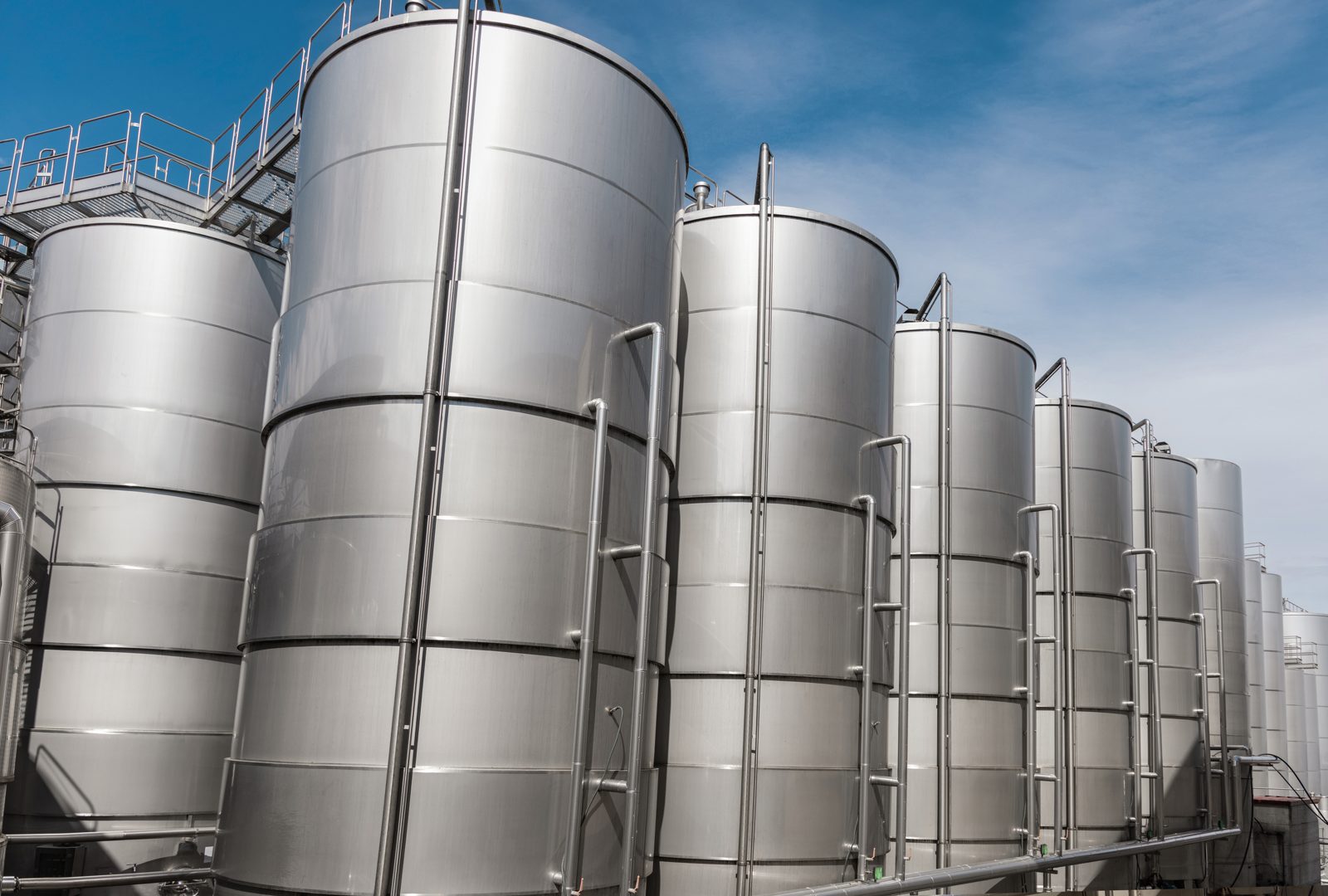 Stainless steel storage tanks at a chemical manufacturing site, representing suppliers listed on CASINDI