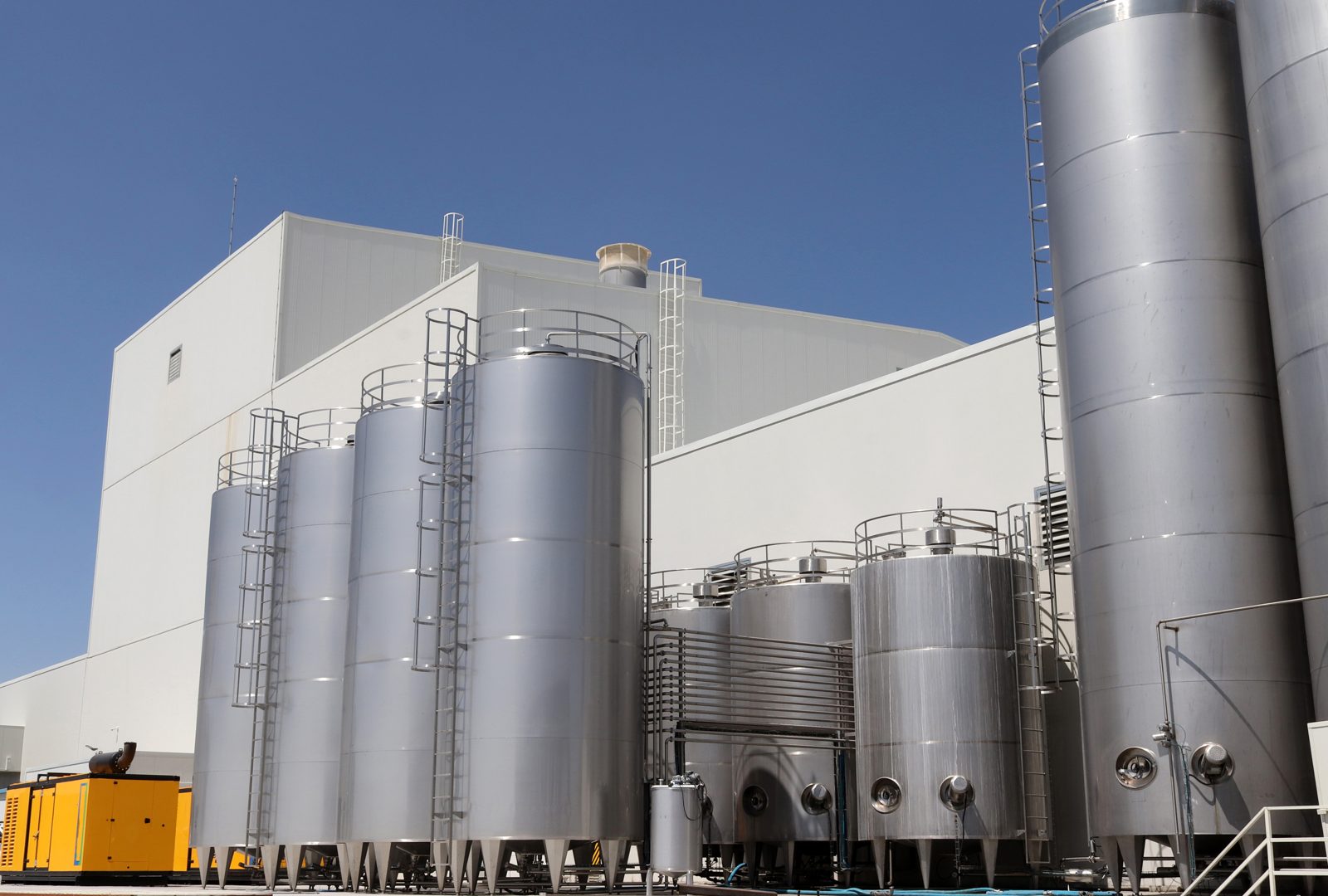 Steel storage tanks at a chemical manufacturing site, representing suppliers that list products on CASINDI