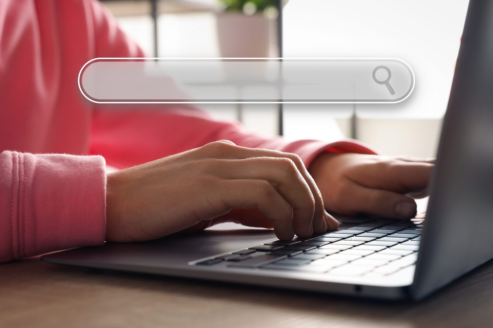 Hands typing on a laptop with a search bar overlay, representing a buyer searching a CAS number on CASINDI